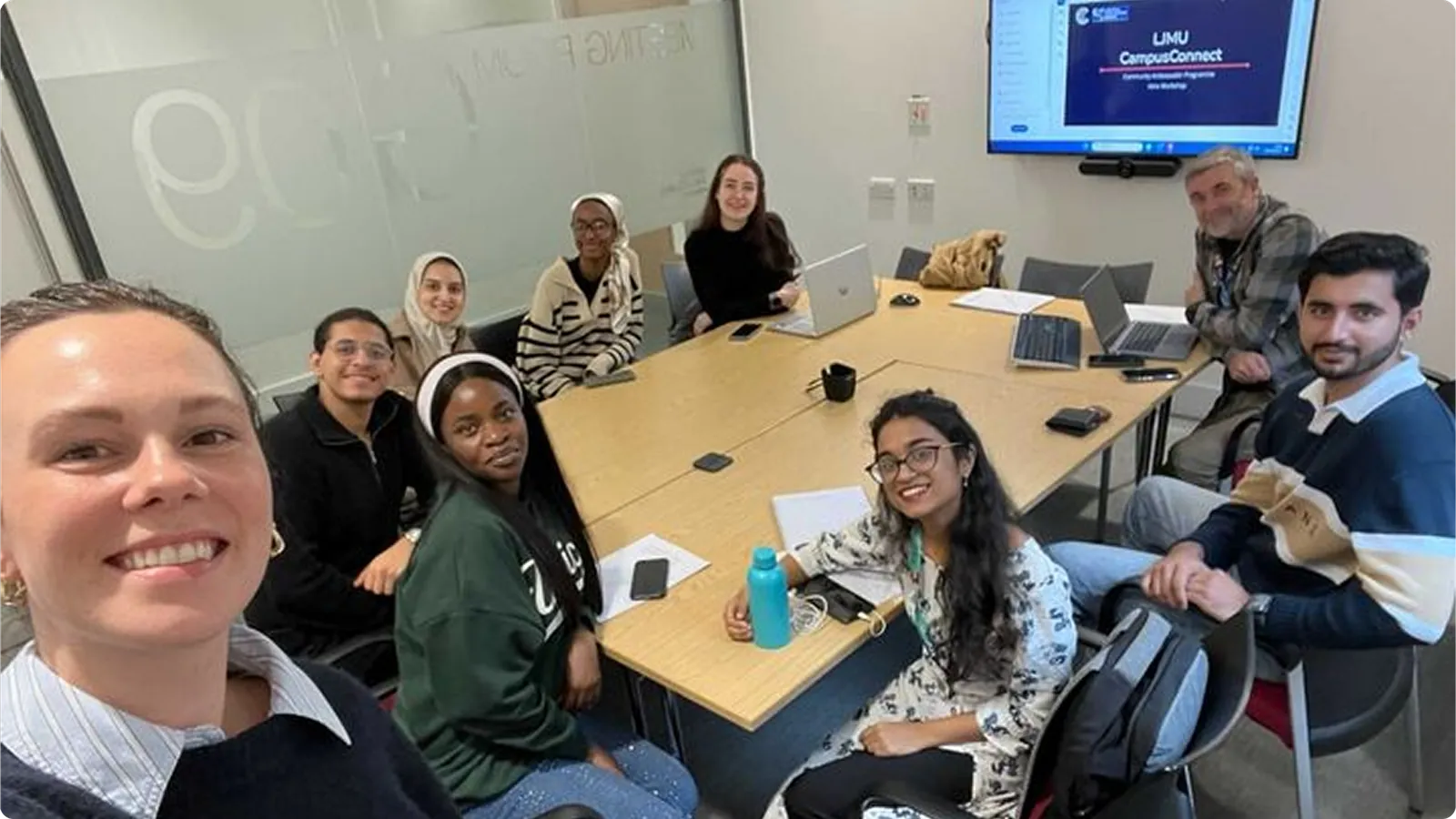 Student ambassadors around a table at a CampusConnect training session